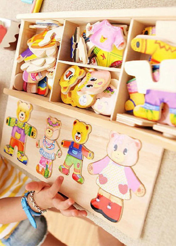 Children playing with a wooden puzzle toy featuring colourful animal shapes.