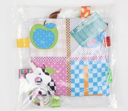Colourful baby teething mat with various patterns in a clear bag 