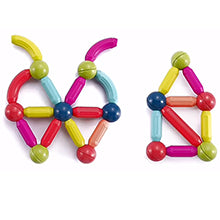 Colourful magnetic building toys shaped like a butterfly and a house on a white background