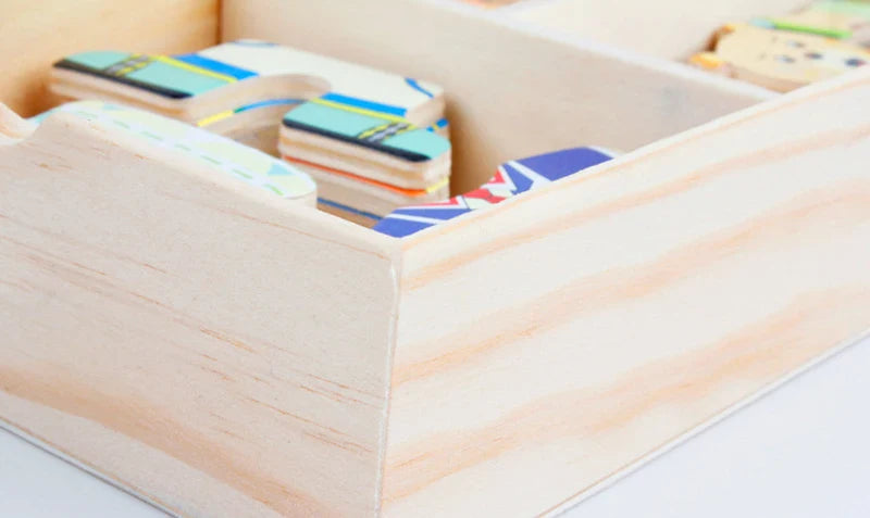 Colourful wooden pieces stored in a wooden box for imaginative play