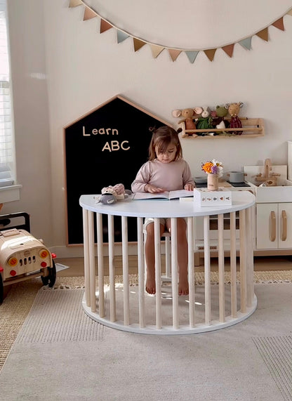 Child climbing wooden Montessori arch
