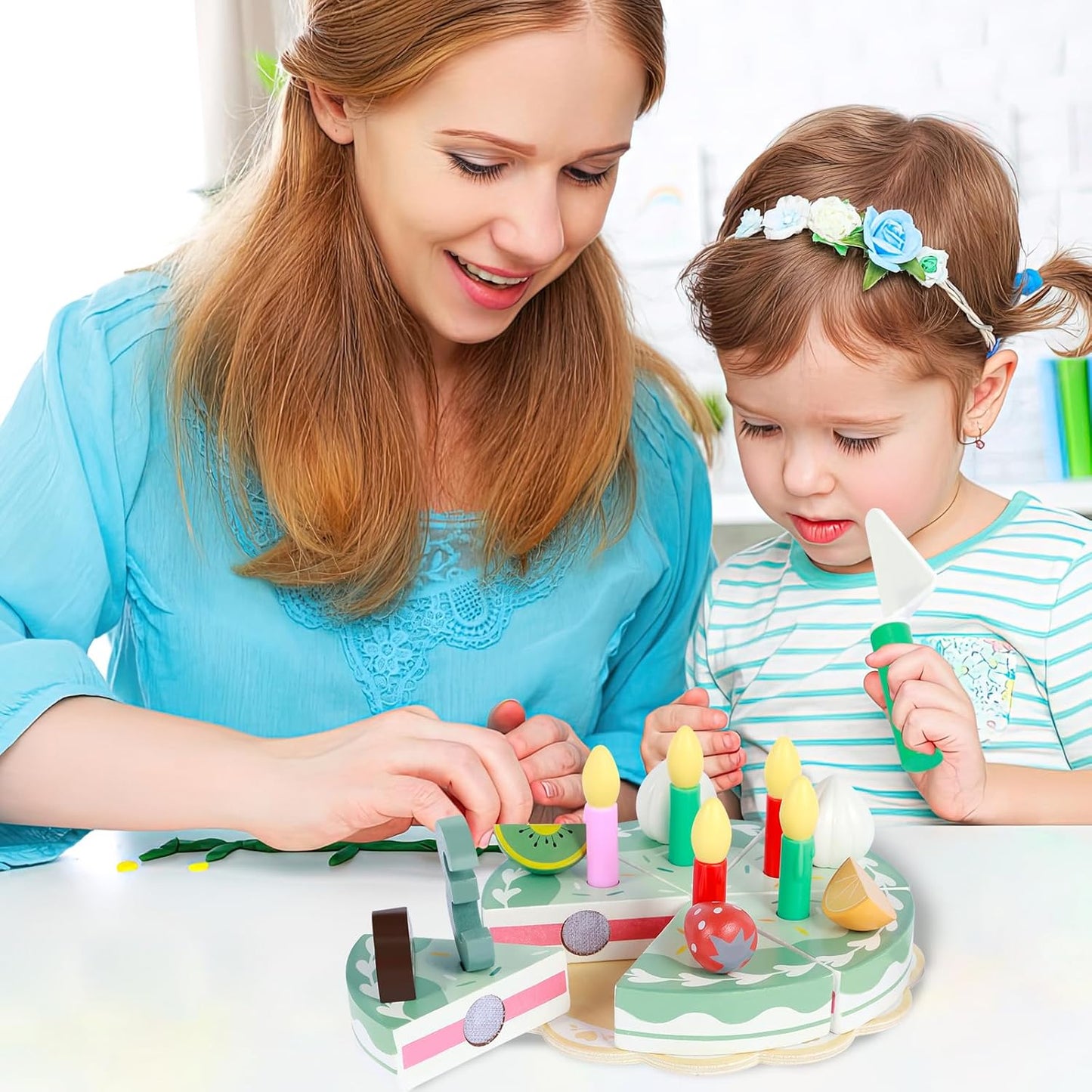 Woman and child playing with a wooden toy cake set