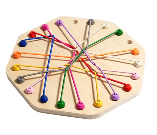 Wooden hexagonal threading toy with 22 holes and colourful elastic cords arranged for fine motor skill development.