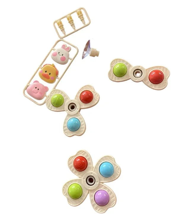 Montessori sensory suction spinner toy attached to bathtub wall
