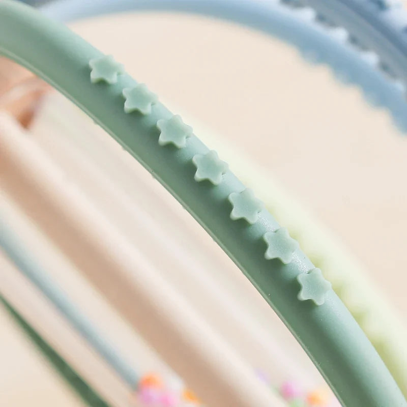 Baby using sensory rattle
