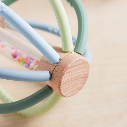 Baby holding rattle toy
