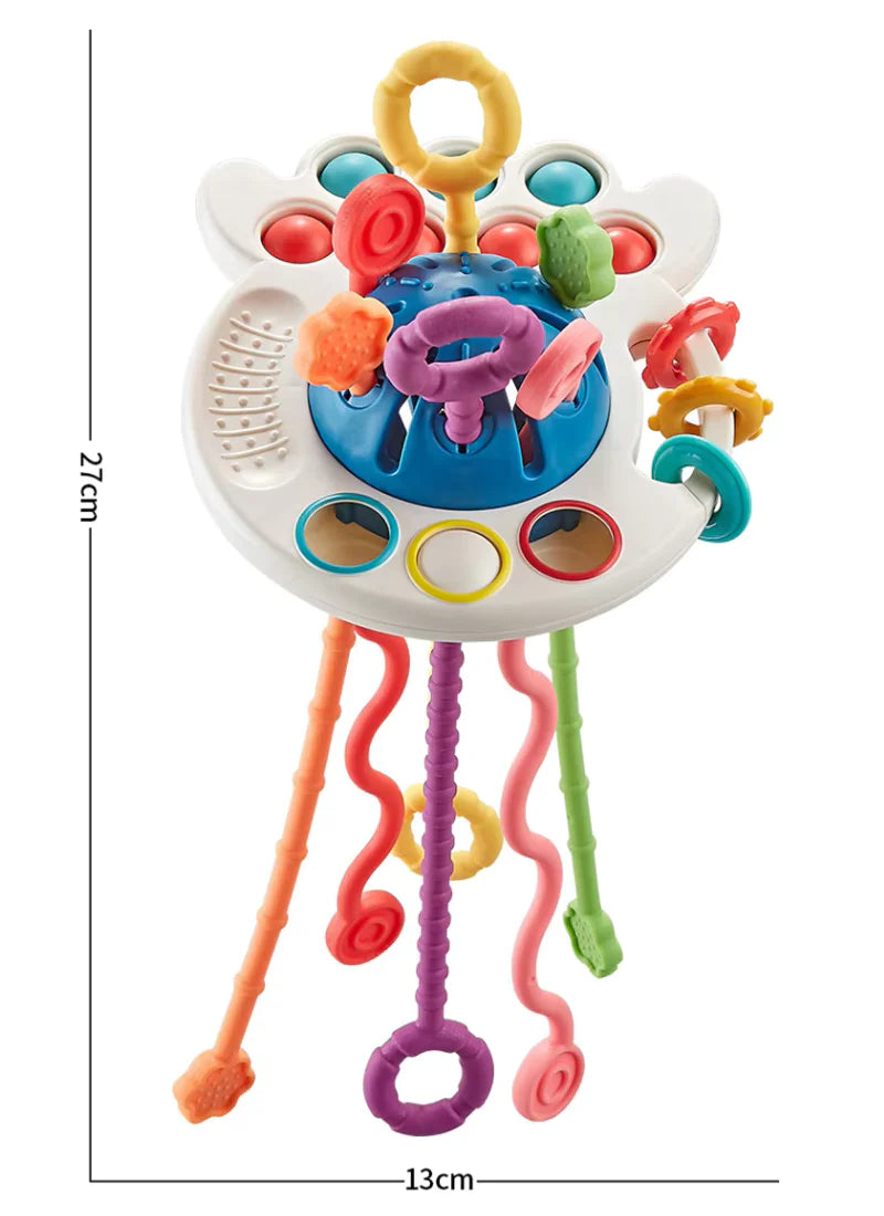 Natural Montessori teething toy arranged with other baby essentials - gift setting