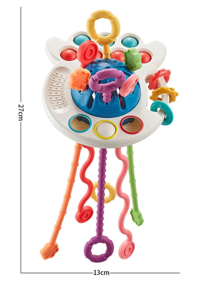 Natural Montessori teething toy arranged with other baby essentials - gift setting