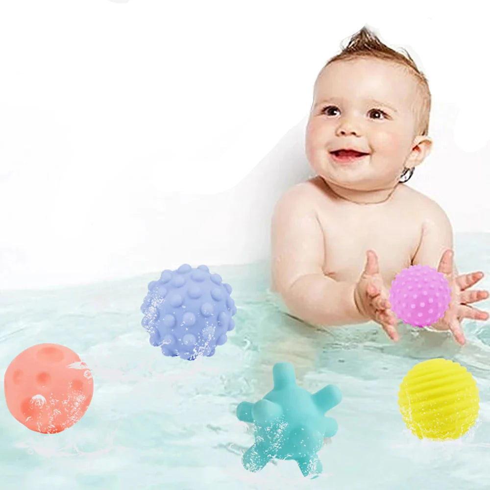 Baby playing with sensory balls teething toy