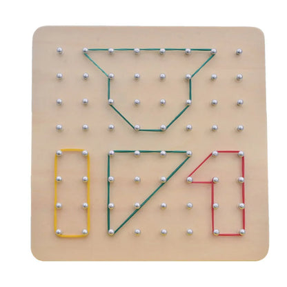 Child creating shapes with geometric nail board