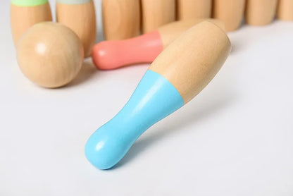 Wooden toy figure with a blue limb 