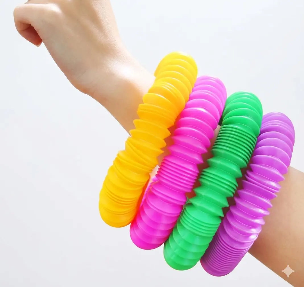 Colourful rWMK Pop Tube on a wrist 