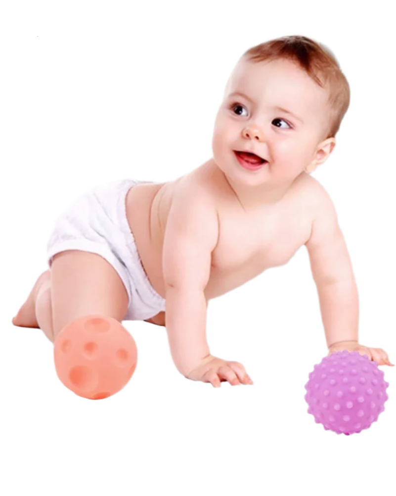 Baby playing with colourful textured balls 